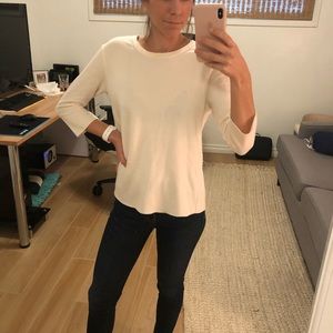 Soft white sweater with open back